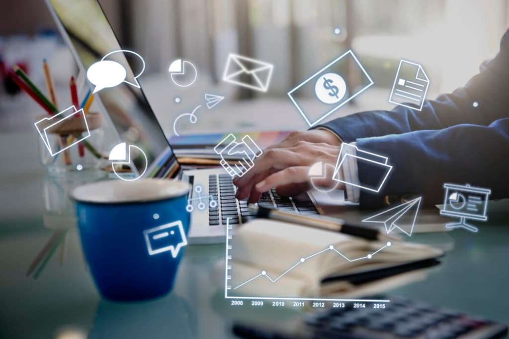 Person working on a laptop with digital icons for communication and finance floating above